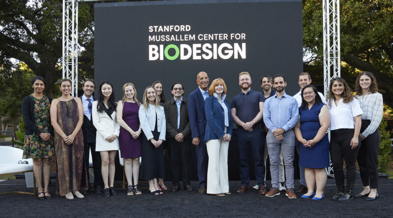 Pictured are Linda and Mike Mussallem on stage with the 2024-25 Stanford Biodesign Innovation and Policy Fellows.